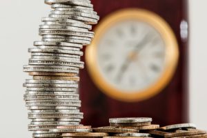 Silver coins and a clock