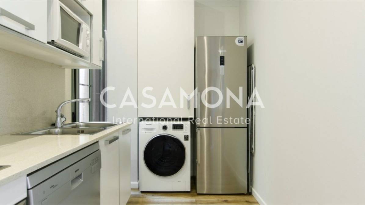 Modern appartement met 2 slaapkamers naast de Arc de Triomf met toeristische vergunning